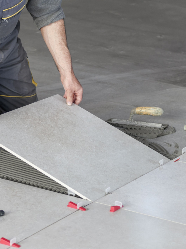 Expert Tilers Gold Coast working on a modern bathroom design